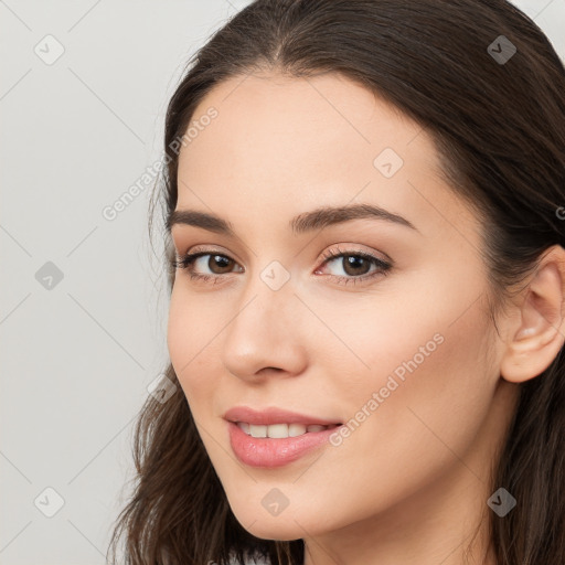 Neutral white young-adult female with long  brown hair and brown eyes