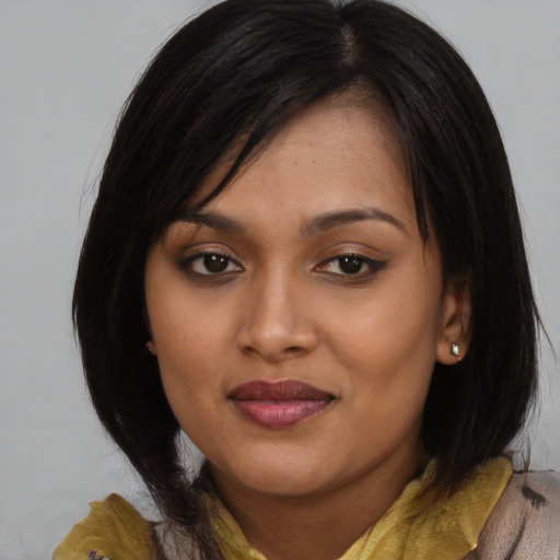 Joyful asian young-adult female with medium  brown hair and brown eyes