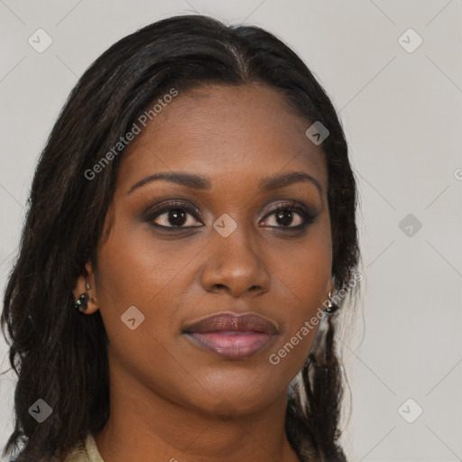 Joyful black young-adult female with long  brown hair and brown eyes