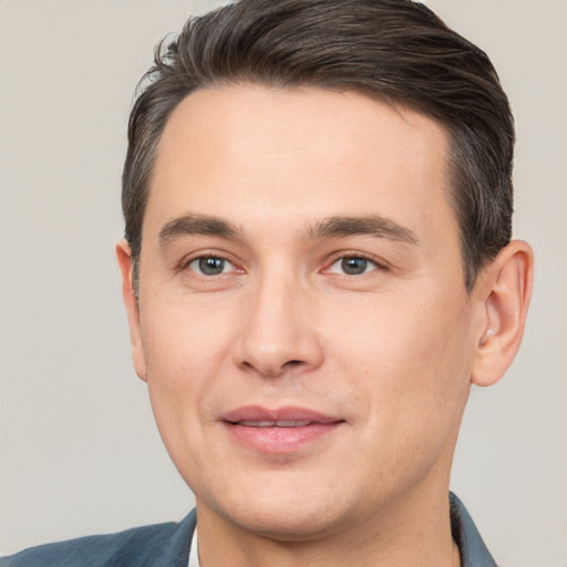 Joyful white young-adult male with short  brown hair and brown eyes