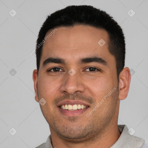 Joyful white young-adult male with short  black hair and brown eyes