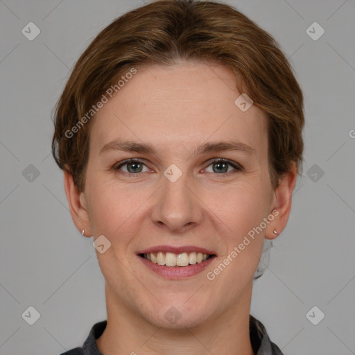 Joyful white young-adult female with short  brown hair and grey eyes