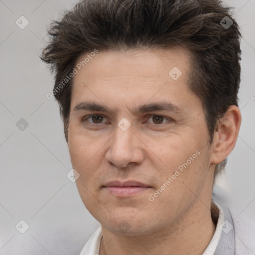 Joyful white adult male with short  brown hair and brown eyes