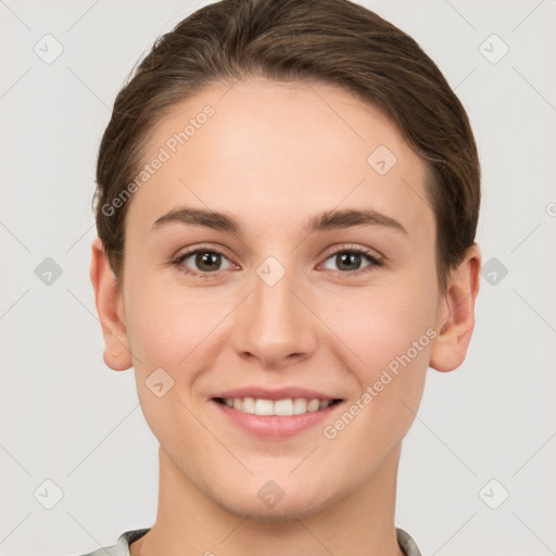 Joyful white young-adult female with short  brown hair and brown eyes