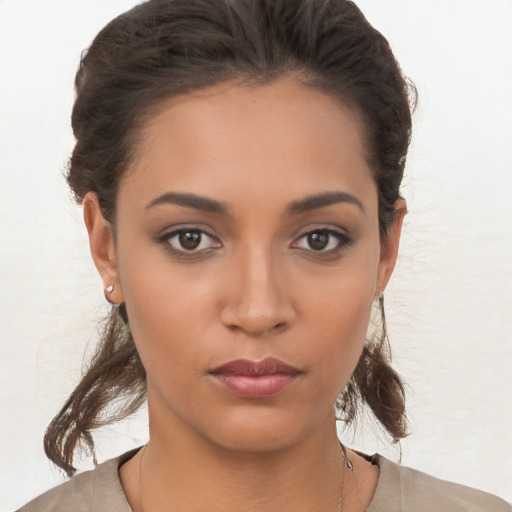 Neutral latino young-adult female with medium  brown hair and brown eyes