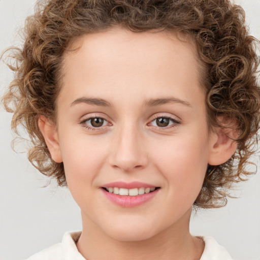 Joyful white child female with medium  brown hair and brown eyes