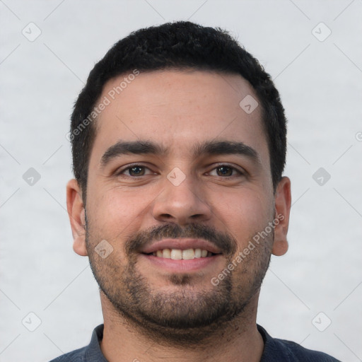 Joyful white young-adult male with short  black hair and brown eyes