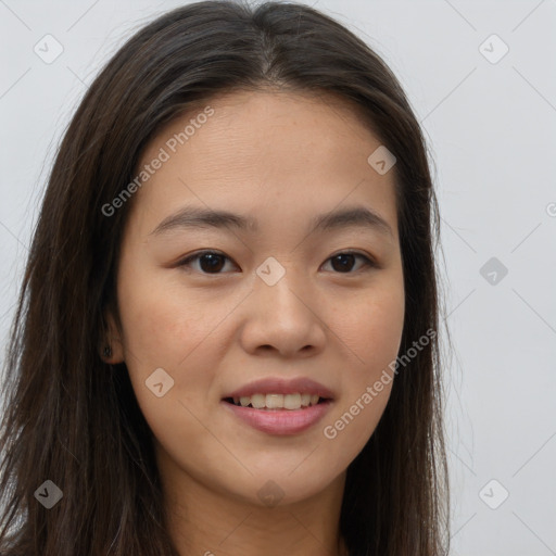 Joyful asian young-adult female with long  brown hair and brown eyes