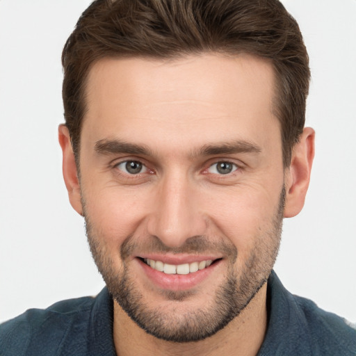 Joyful white young-adult male with short  brown hair and brown eyes