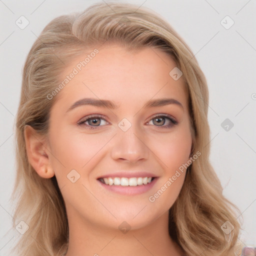 Joyful white young-adult female with long  brown hair and blue eyes