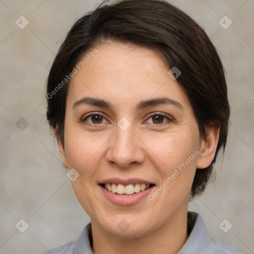 Joyful white adult female with medium  brown hair and brown eyes