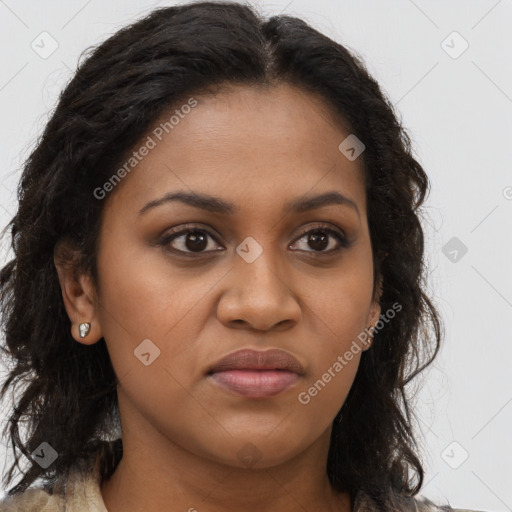 Joyful black young-adult female with long  brown hair and brown eyes