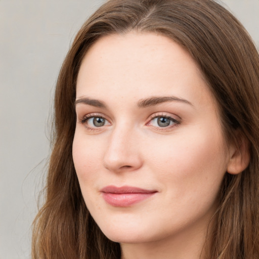 Neutral white young-adult female with long  brown hair and blue eyes