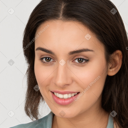 Joyful white young-adult female with long  brown hair and brown eyes