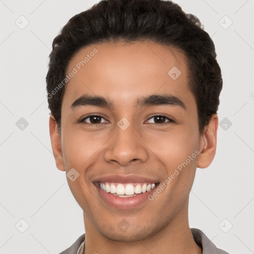 Joyful latino young-adult male with short  brown hair and brown eyes