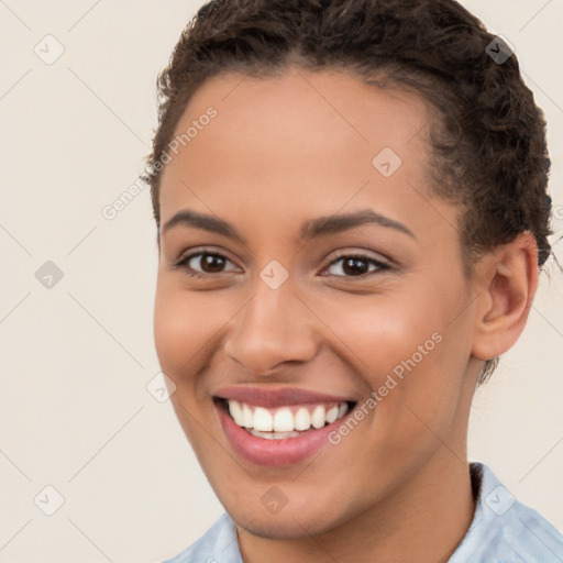 Joyful white young-adult female with short  brown hair and brown eyes