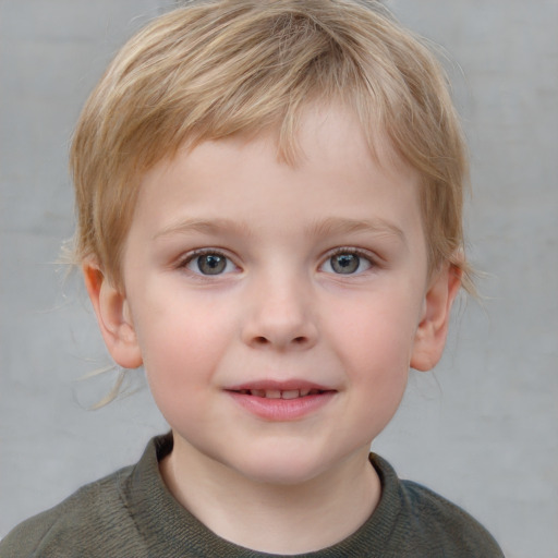 Joyful white child male with short  brown hair and blue eyes