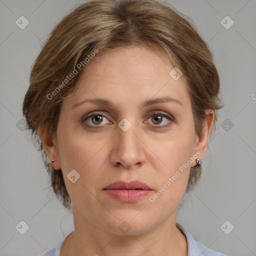 Joyful white adult female with medium  brown hair and grey eyes