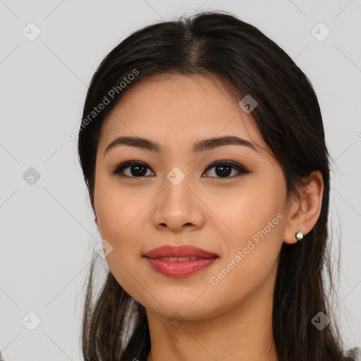 Joyful asian young-adult female with long  brown hair and brown eyes