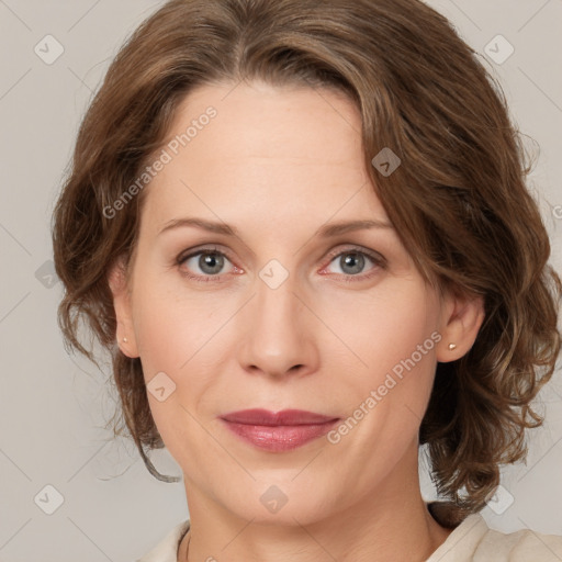 Joyful white adult female with medium  brown hair and grey eyes