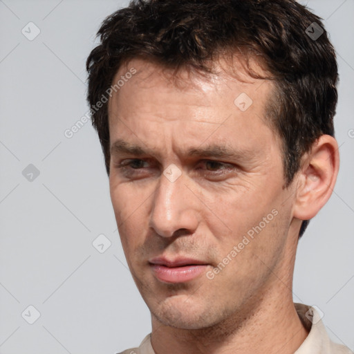 Neutral white adult male with short  brown hair and brown eyes