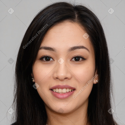 Joyful asian young-adult female with long  brown hair and brown eyes