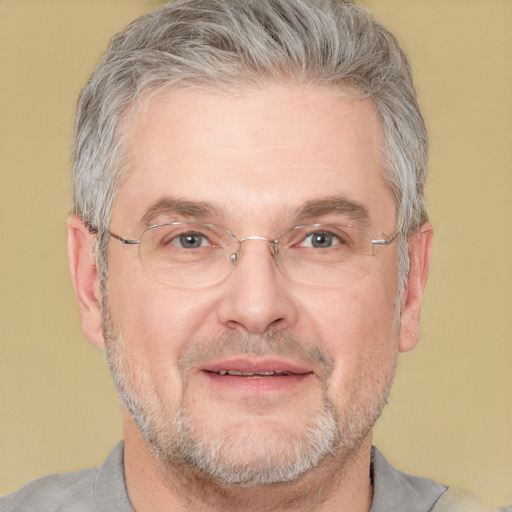 Joyful white middle-aged male with short  gray hair and brown eyes