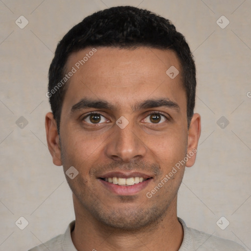 Joyful white young-adult male with short  black hair and brown eyes