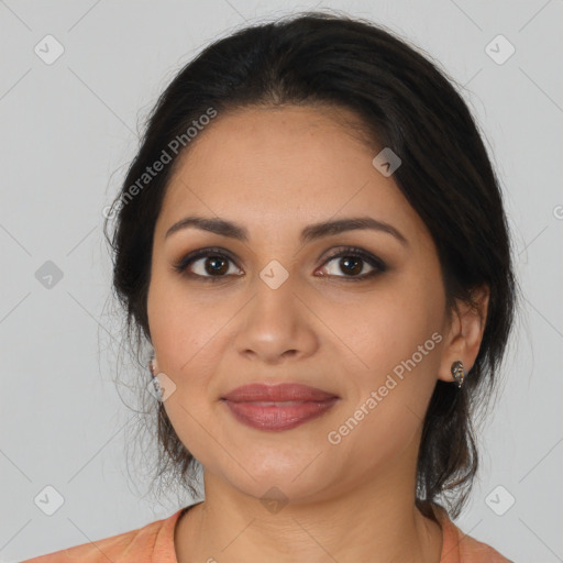 Joyful latino young-adult female with medium  brown hair and brown eyes