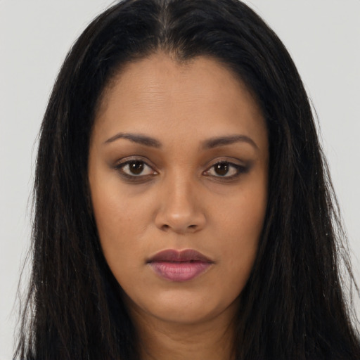 Joyful asian young-adult female with long  brown hair and brown eyes