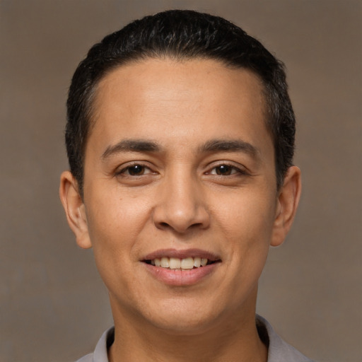 Joyful white young-adult male with short  black hair and brown eyes