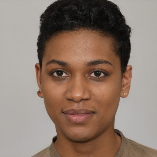 Joyful black young-adult female with short  black hair and brown eyes