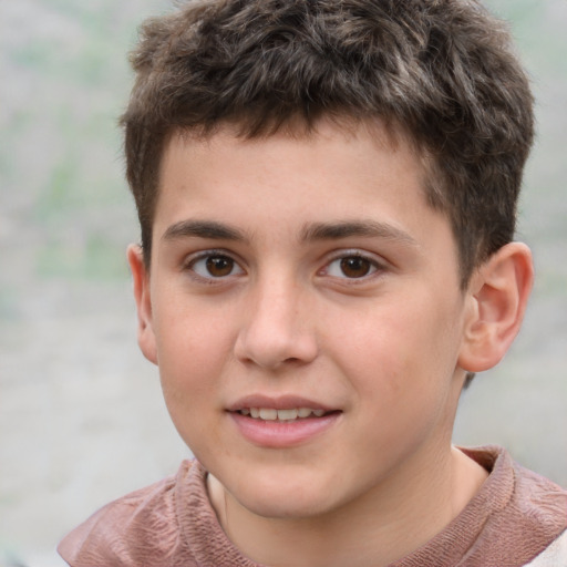 Joyful white child male with short  brown hair and brown eyes