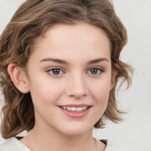 Joyful white child female with medium  brown hair and brown eyes