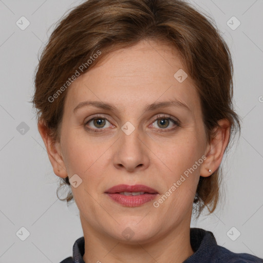 Joyful white adult female with medium  brown hair and blue eyes