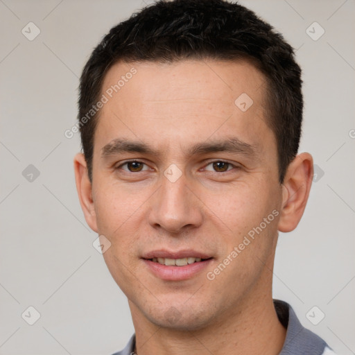 Joyful white young-adult male with short  brown hair and brown eyes