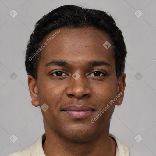 Joyful black young-adult male with short  black hair and brown eyes