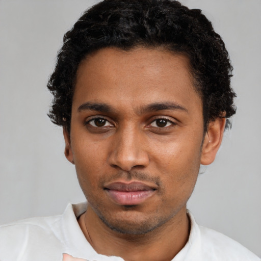 Neutral black young-adult male with short  black hair and brown eyes