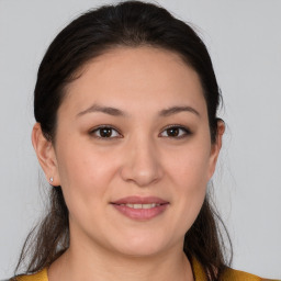 Joyful white young-adult female with medium  brown hair and brown eyes