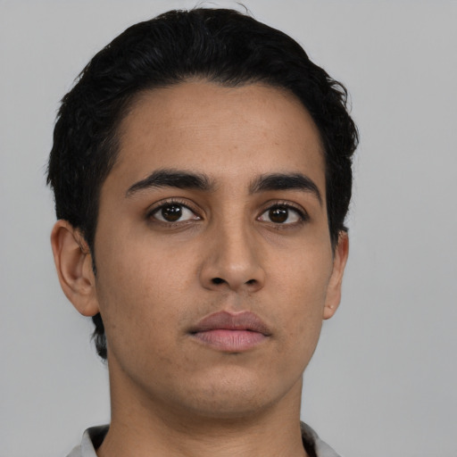 Neutral latino young-adult male with short  black hair and brown eyes