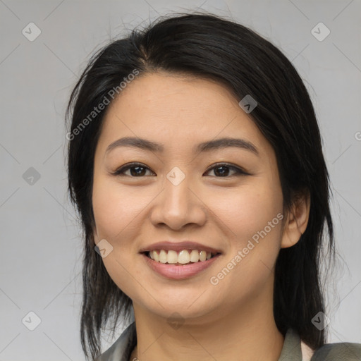 Joyful asian young-adult female with medium  black hair and brown eyes