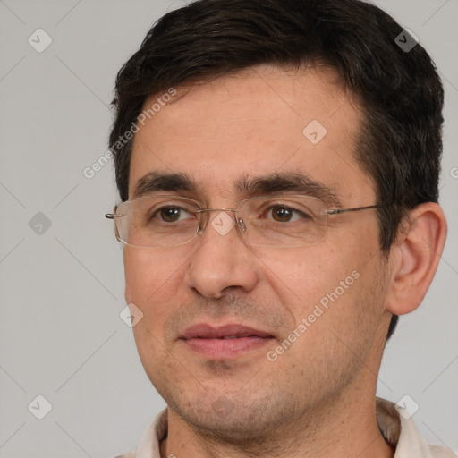 Joyful white adult male with short  brown hair and brown eyes