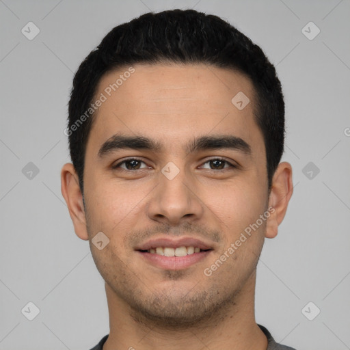 Joyful white young-adult male with short  black hair and brown eyes