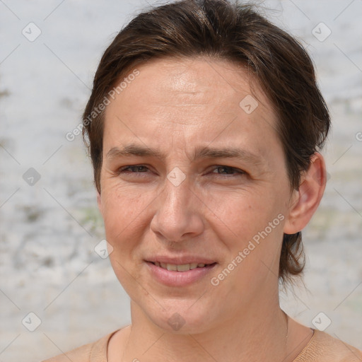 Joyful white adult female with short  brown hair and brown eyes