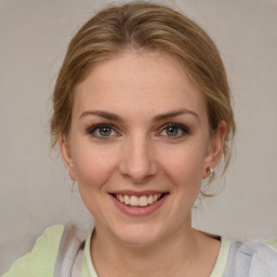 Joyful white young-adult female with medium  brown hair and blue eyes