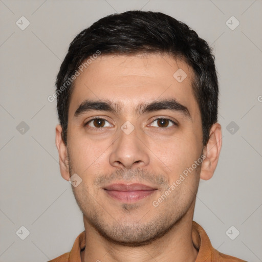 Joyful white young-adult male with short  black hair and brown eyes