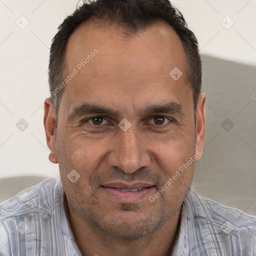 Joyful white adult male with short  brown hair and brown eyes