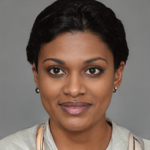 Joyful latino young-adult female with short  black hair and brown eyes
