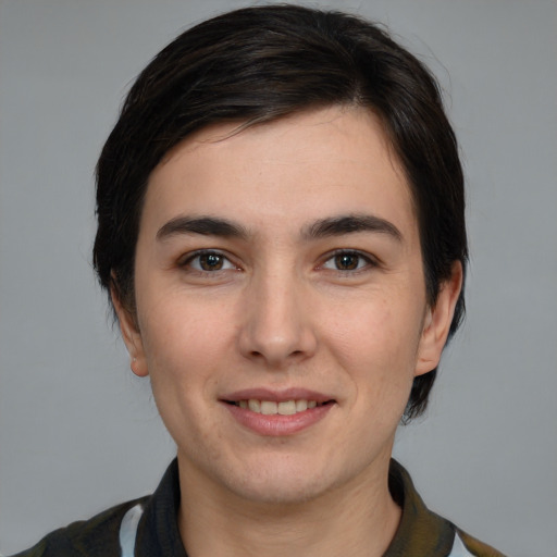 Joyful white young-adult male with medium  brown hair and brown eyes