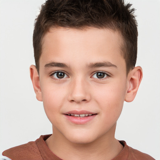 Joyful white child male with short  brown hair and brown eyes